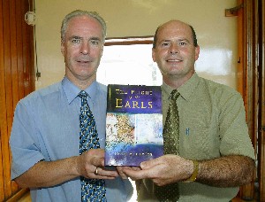 Dr John McCavitt (Head of Politics) presents a copy of his newly published book to the Headmaster