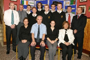 Mr. Dermot  McGovern Headmaster, congratulates the six pupils that obtained top awards in their GCSE exams. Included are the successful pupils with their subject teachers. Pupils are  Stephen Begley, Sean McClory, Steven Corcoran, Philip Knox, Daniel McAlinden and Kevin McManus. Teachers of these pupils are Mr. Gerald Morgan, Mr. Maurice McKevitt, Mrs. Mildred Rooney, Miss Mairead Quinn, Dr. Sean Fee, Mr. Gervase Patterson and Mrs. Orla McGinley. Missing are Mr. Dominic Wadsworth and Mrs. Mary MacGinty