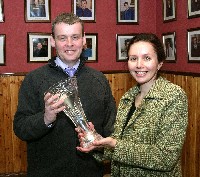 Ms Ann O'Sullivan, Analog Devices presents Mr. Tony Mooney, Head of Technology with his Educator of Excellence Award that he won at the recent Esat BT Young Scientist and Technology Exhibition to acknowledge the success that his pupils have had at this competition over the last four years, this includes an all expenses paid trip to America.
