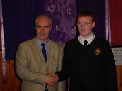 Pictured here with Mr. Dermot McGovern,Headmaster is Eoin McGuinness All Star Hurling winner 2004/05.