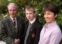 Mr Dermot McGovern, Headmaster congratulates Kevin O'Reilly along with Mary Black, Maths teacher.