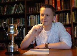 Christopher Keeley receives his award at the Young Authors and Artists awards ceremony, organised by the National Deaf Children's Society. 