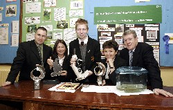 Fifth year student Kevin O'Reilly from Bessbrook being congratulated by Mr Val Kane, Vice- Principal (on right) on winning the Individual Runner Up prize for his project Feeding behaviour of the Fresh Water Shrimp Gammarus Pulex'.  He discovered new information about its lifestyle in his project which netted him a cheque for 750 and a specially designed Waterford Crystal Trophy. Kevin worked under the guidance of Mrs.Margaret Lane, Head of Biology (second right) and Miss Deirdre Mulgrew. Also included is John Rath, Senior Teacher. 