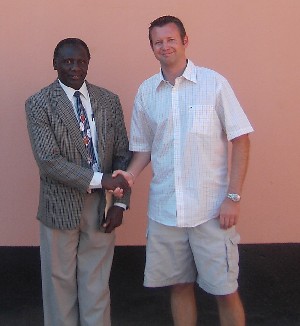Mr Mark Grogan congratulates Mr Teddy Nyirongo on his new post